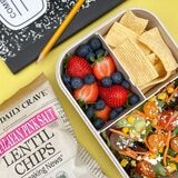 chips in a lunchbox next to fruit