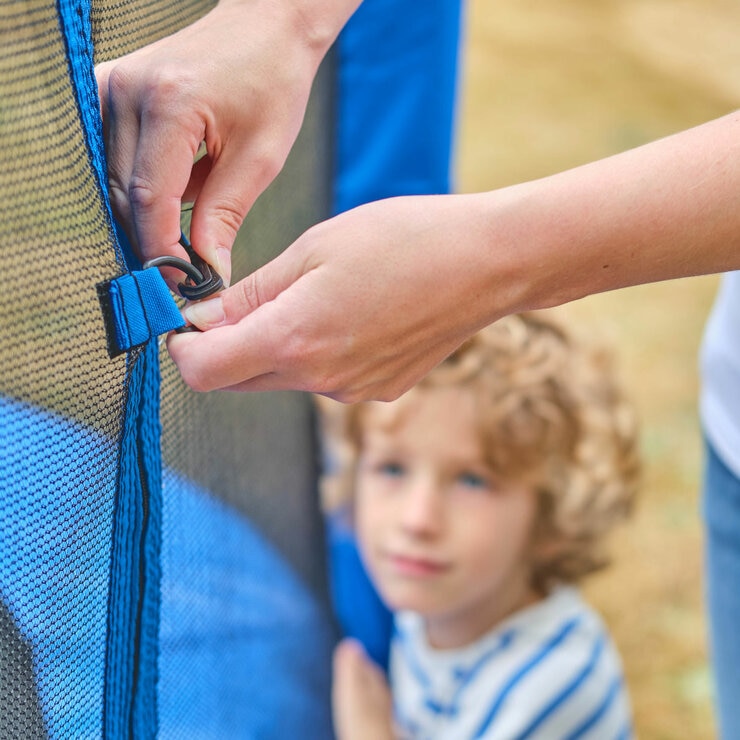 Lifestyle image of someone using the clips on the trampoline