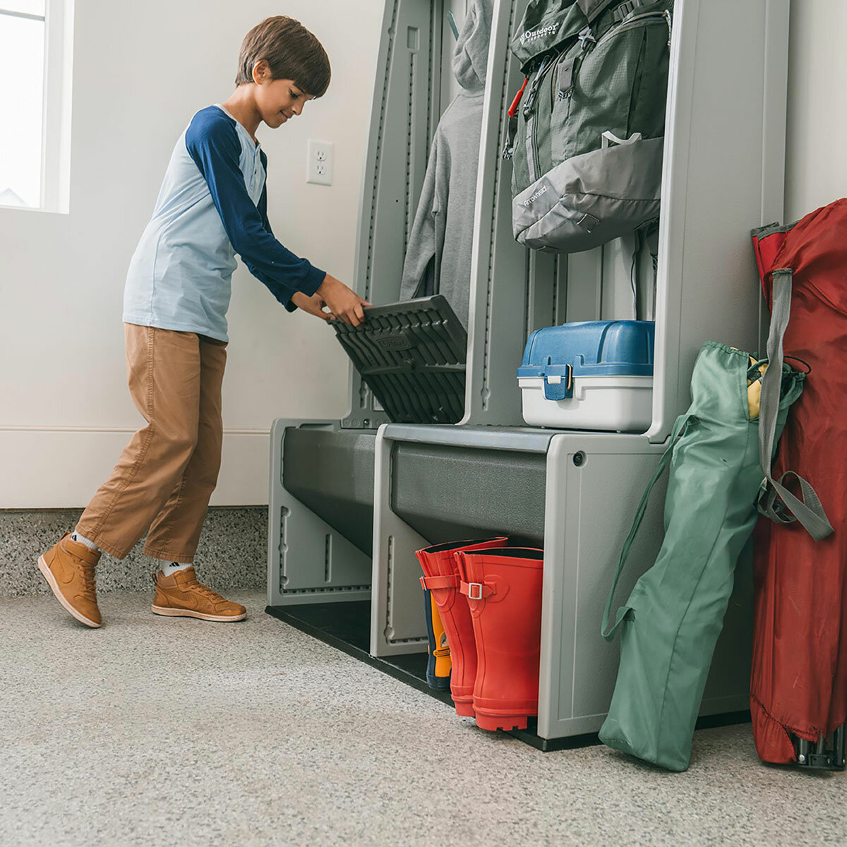 Lifestyle image showing a child lifting the seat on the storage locker Lifestyle image showing a child lifting the seat on the storage locker