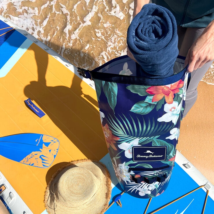 Lifestyle image of someone putting items into the dry bag