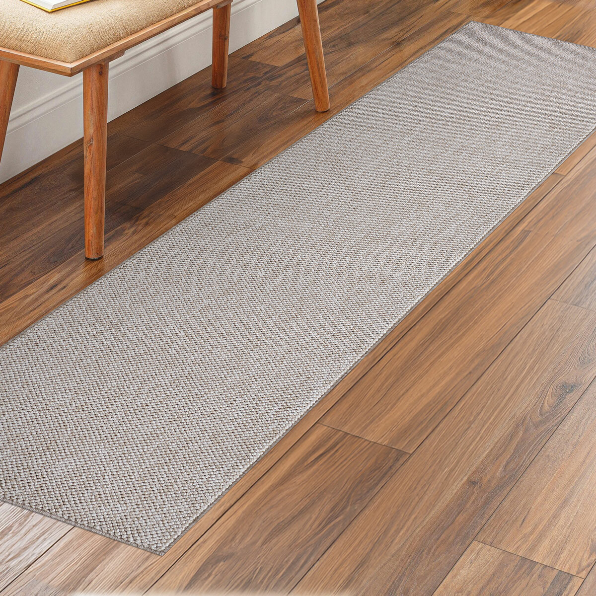 runner rug with a textured surface placed on a wooden floor