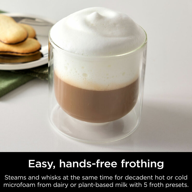 Lifestyle image of  Ninja Luxe Café Pro Espresso Machine showing hands free frothing