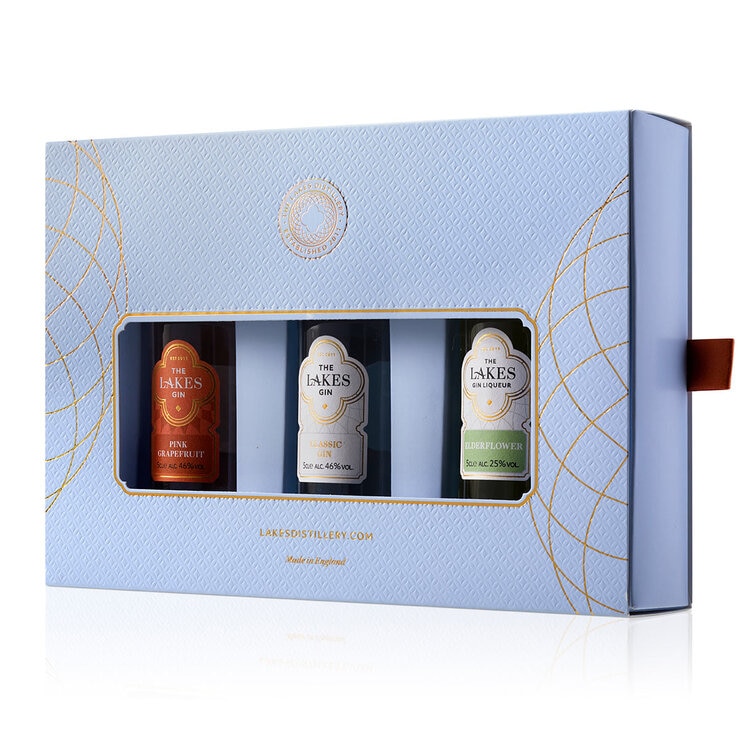Side on view of gift pack of 3 gins in blue cardboard box Side on view of gift pack of 3 gins in blue cardboard box