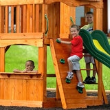 Lifestyle image of a child climbing the ladder, another climbing the rock wall, and another looking out from the bottom of the playcentre Lifestyle image of a child climbing the ladder, another climbing the rock wall, and another looking out from the bottom of the playcentre