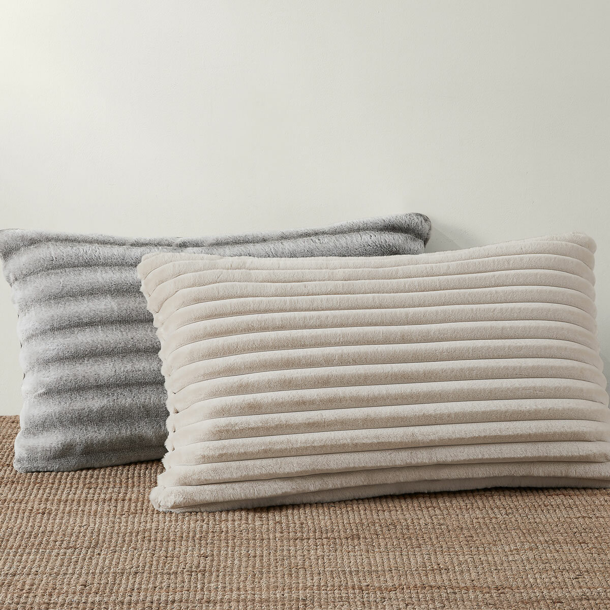 XL ribbed pillows with a plush texture resting on a textured floor
