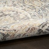 Grey and beige rug with detailed symmetrical pattern and vintage-style accents Grey and beige rug with detailed symmetrical pattern and vintage-style accents