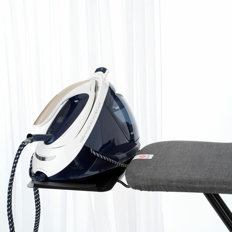 lifestyle image of brabantia ironing board close up with an iron on the rest