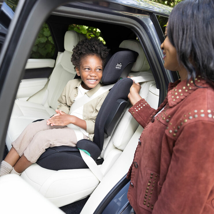 Lifestyle image of a child buckled into the car seat