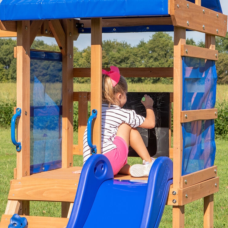 Lifestyle image of a child using the chalkboard