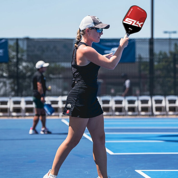 Lifestyle image of a person playing pickleball