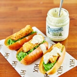 Open Jar with Sauce on Hot Dogs