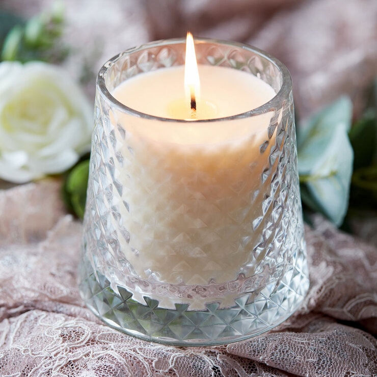 Lifestlye image of candle in clear glass