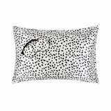 White pillowcase with black irregular dot pattern, paired with a matching sleep mask featuring black ruffled band. Coordinated set offers playful design and soft comfort. White pillowcase with black irregular dot pattern, paired with a matching sleep mask featuring black ruffled band. Coordinated set offers playful design and soft comfort.