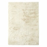 beige-coloured fluffy textured rug