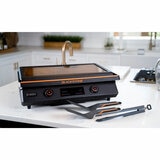 Lifestyle image of electric griddle closed on kitchen counter Lifestyle image of electric griddle closed on kitchen counter