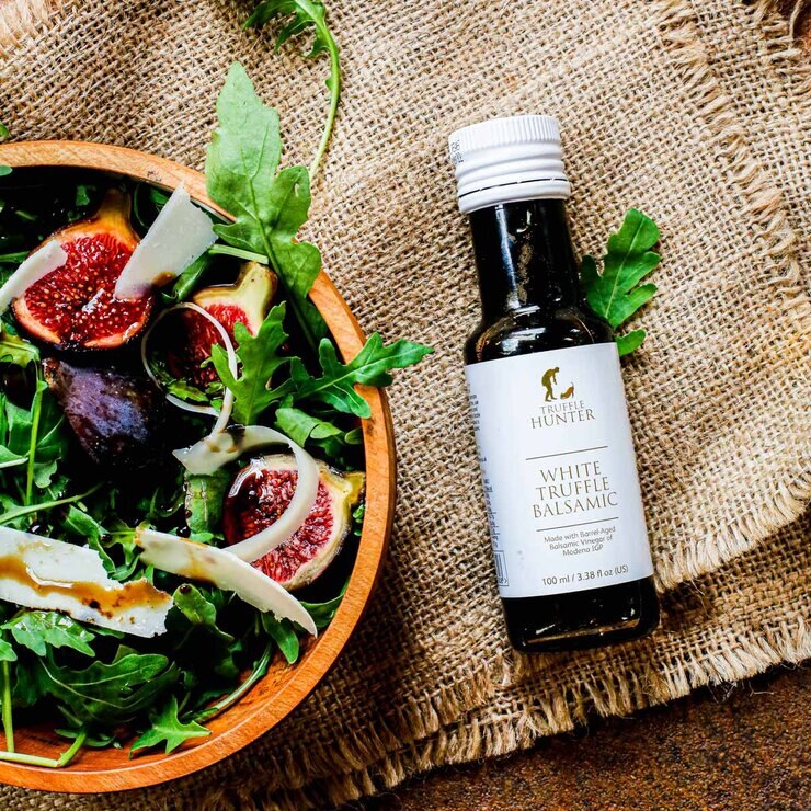Truffle Hunter White Truffle Balsamic Vinegar next to bowl of food Truffle Hunter White Truffle Balsamic Vinegar next to bowl of food