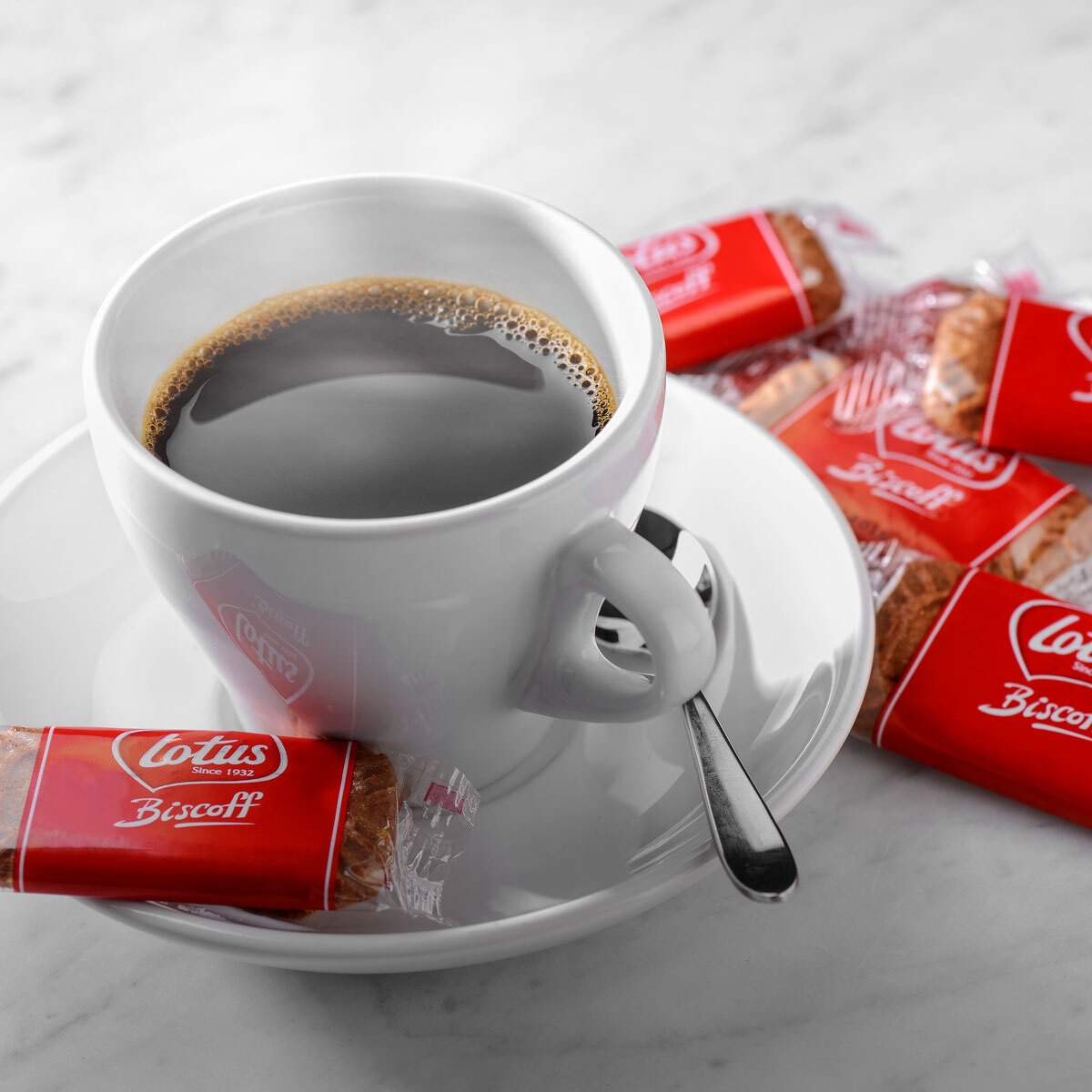 Lotus Biscuit Next to a Cup of Coffee