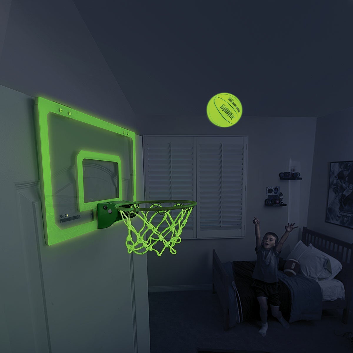 Lifestyle image showing how the ball and hoop glow in the dark Lifestyle image showing how the ball and hoop glow in the dark