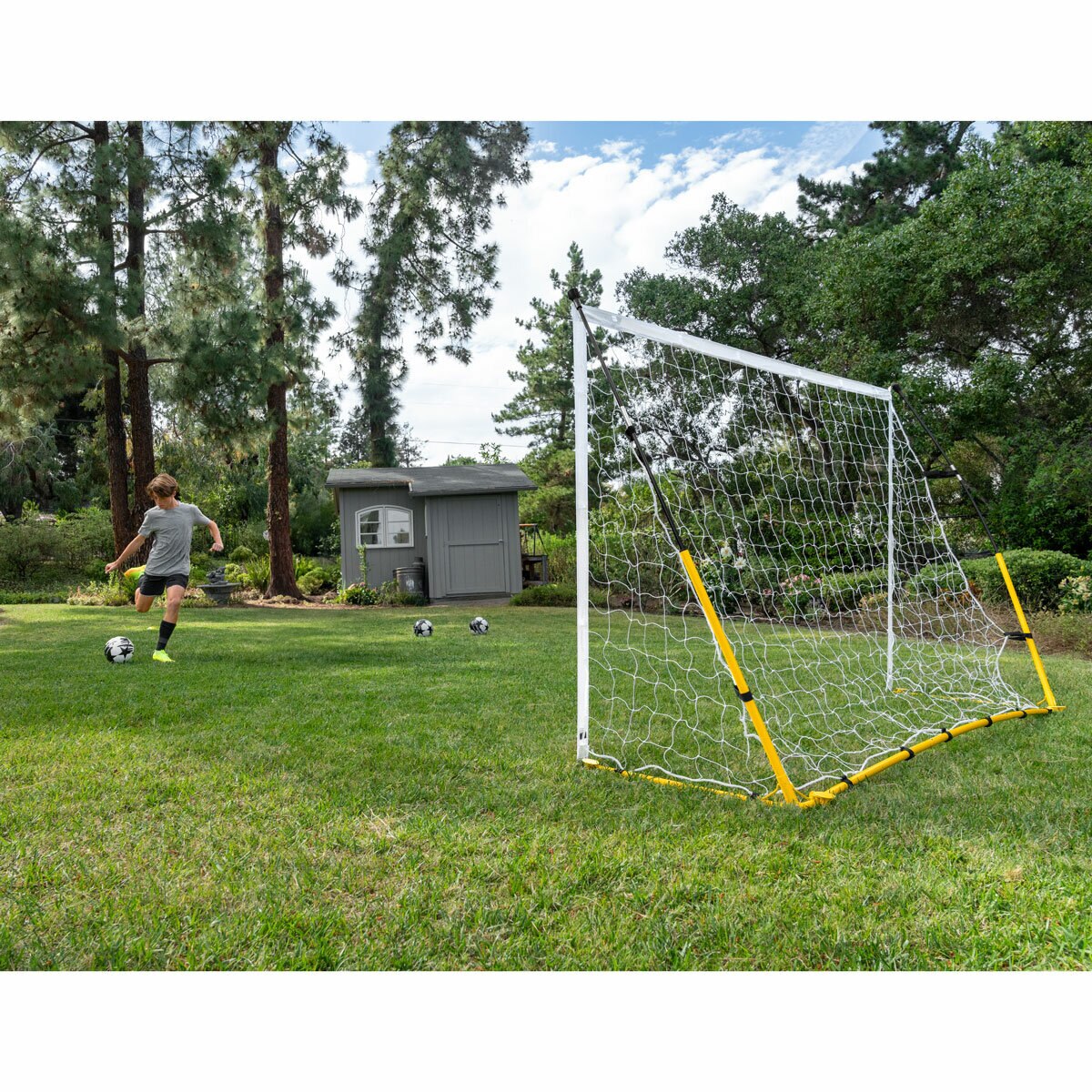 Lifestyle image of someone kicking a ball into the goal Lifestyle image of someone kicking a ball into the goal