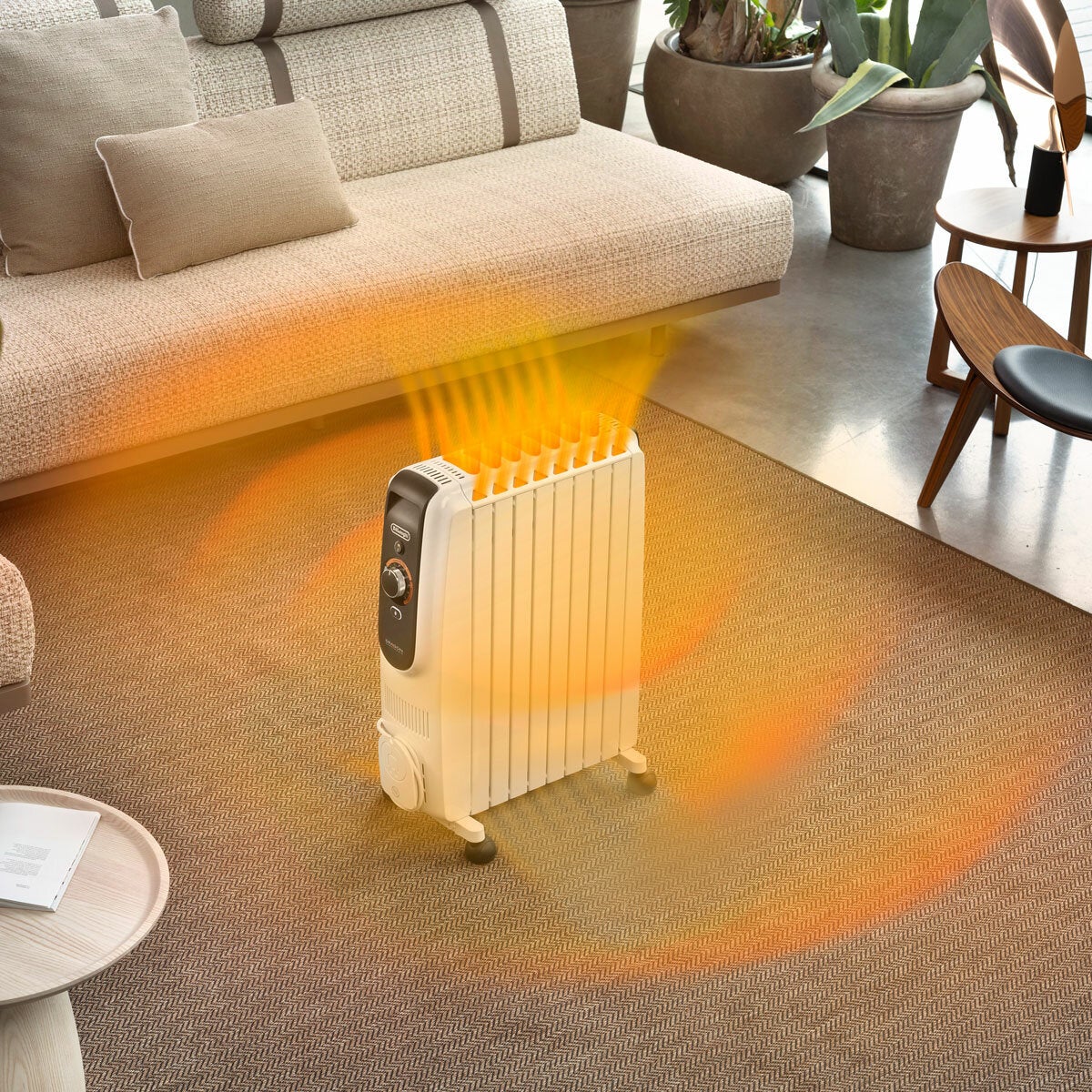 Lifestyle image of De'Longhi Oil Filled Radiator in a living room Lifestyle image of De'Longhi Oil Filled Radiator in a living room