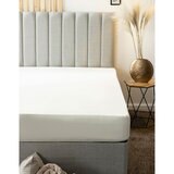 image showing cream snug bundle fitted sheet on a matress