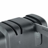 Close up of GRAEF knife sharpener sharpening knife Close up of GRAEF knife sharpener sharpening knife