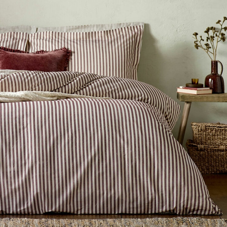 Striped duvet set with vertical burgundy and white lines, paired with matching pillowcases