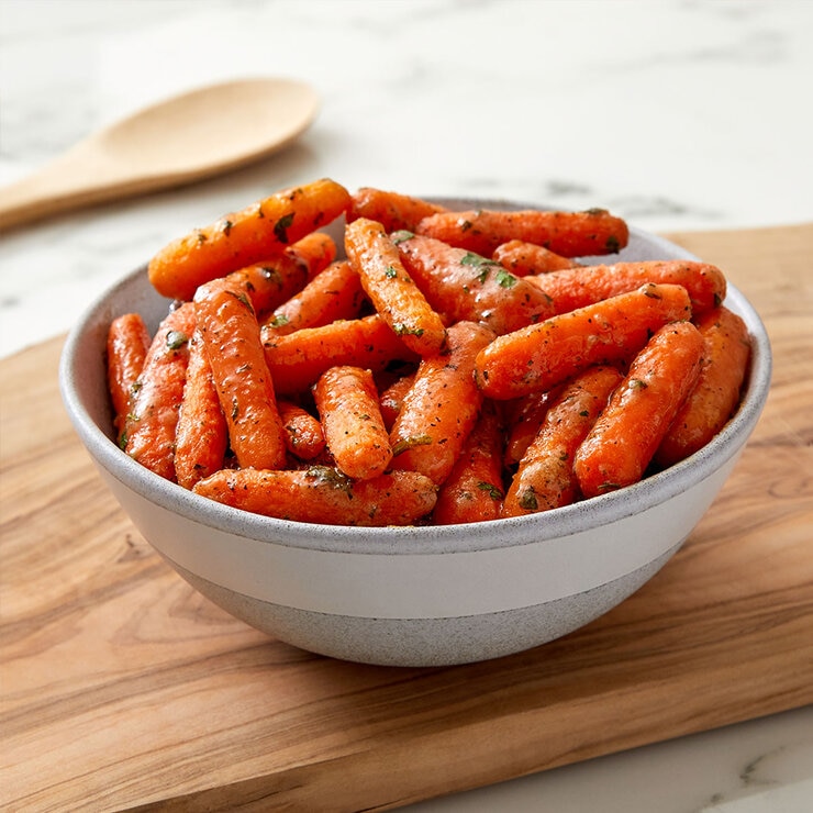 Carrots covered in herbs in a Bowl
