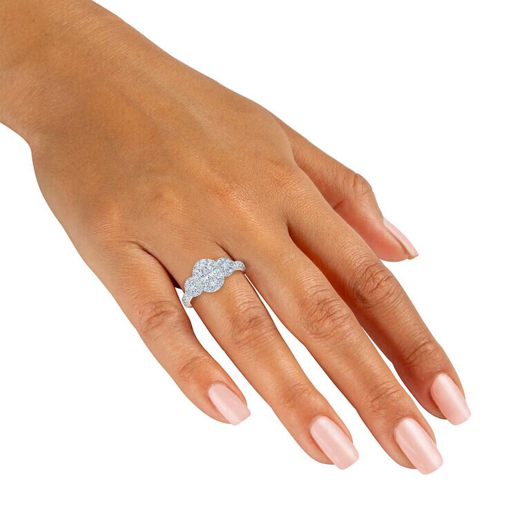 1.52ctw Oval & Round Brilliant Cut Diamond Three Stone Halo Ring, 14ct White Gold 1.52ctw Oval & Round Brilliant Cut Diamond Three Stone Halo Ring, 14ct White Gold