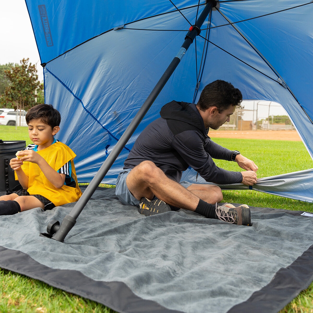 Lifestyle image of someone tying the window on the shelter