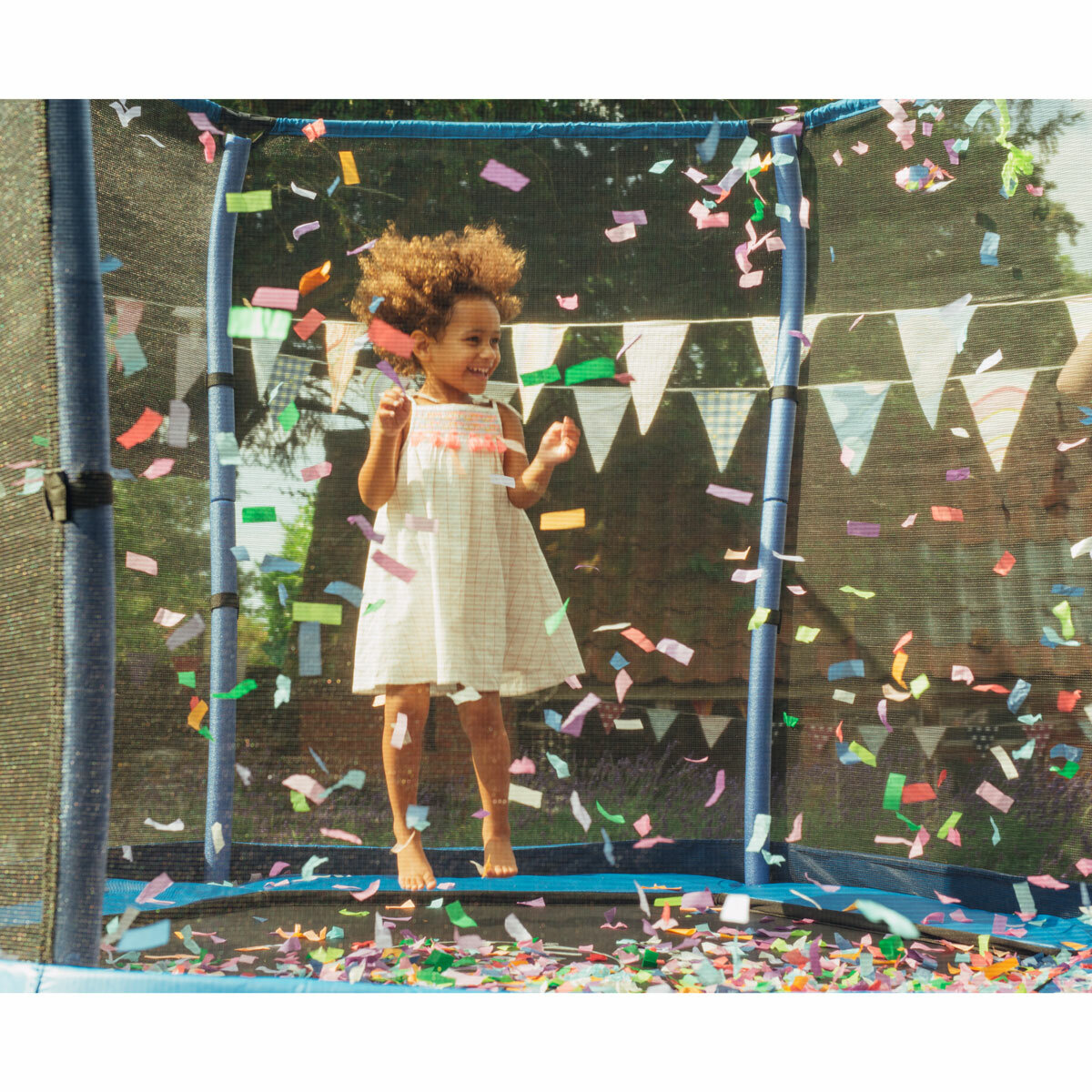 Lifestyle image of a child jumping on the trampoline