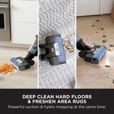 Lifestyle image of Shark HydroVac Cordless Hard Floor Cleaner cleaning hard floors and rugs