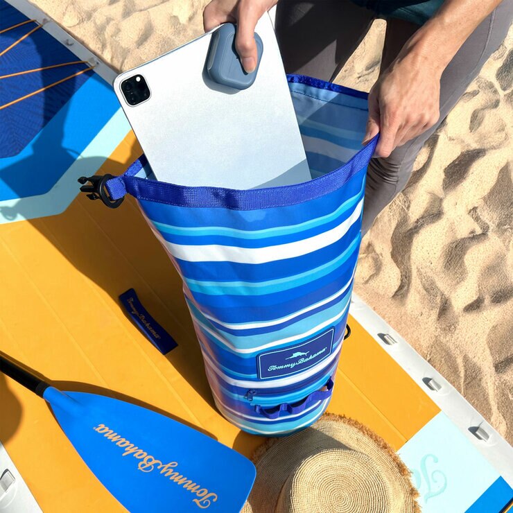 Lifestyle image of someone putting items into the dry bag