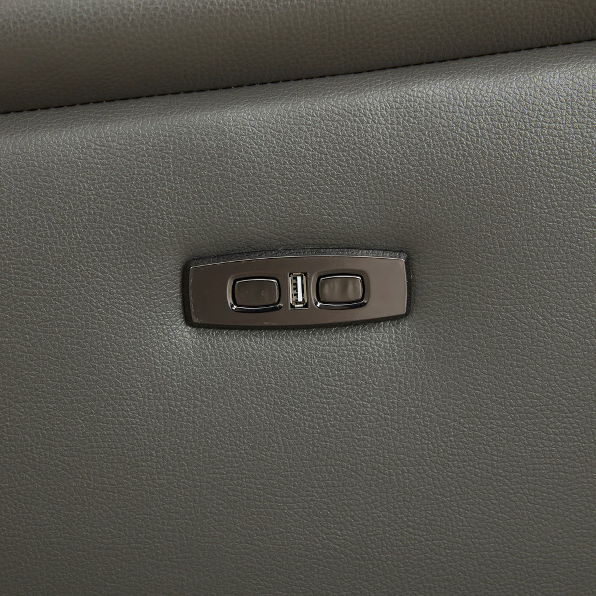 Reclining buttons on side of Kuka Leather Power Armchair