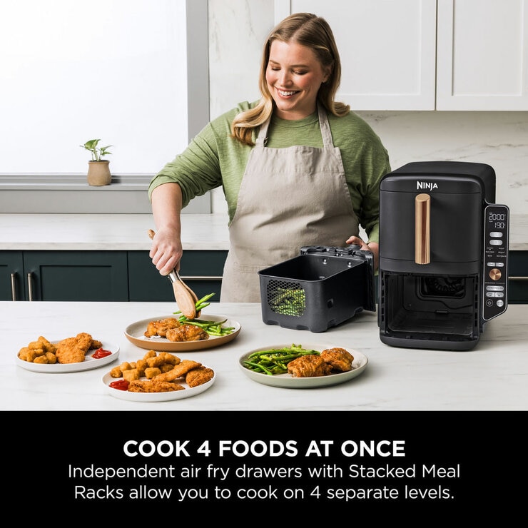 Lifestyle image of Ninja Double Stack 9.5L Air Fryer being used in the kitchen