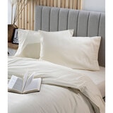 image showing cream snug bundle set up close featuring the pillow cases and top of mattress