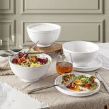 lifestyle image of bowls with plates and lids