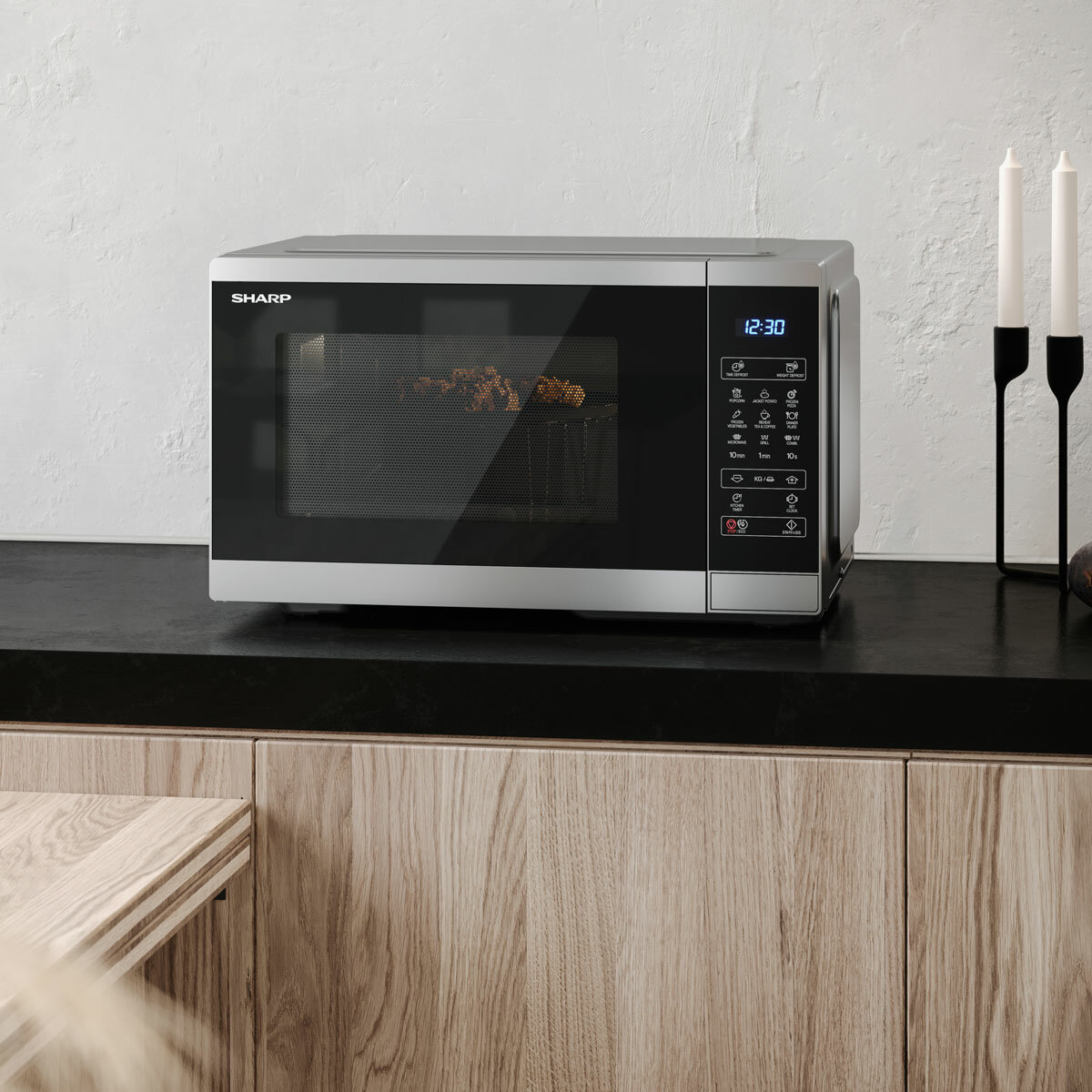 Lifestyle image of Sharp 28 Litre 900W Digital Microwave with 1100W Grill on kitchen top
