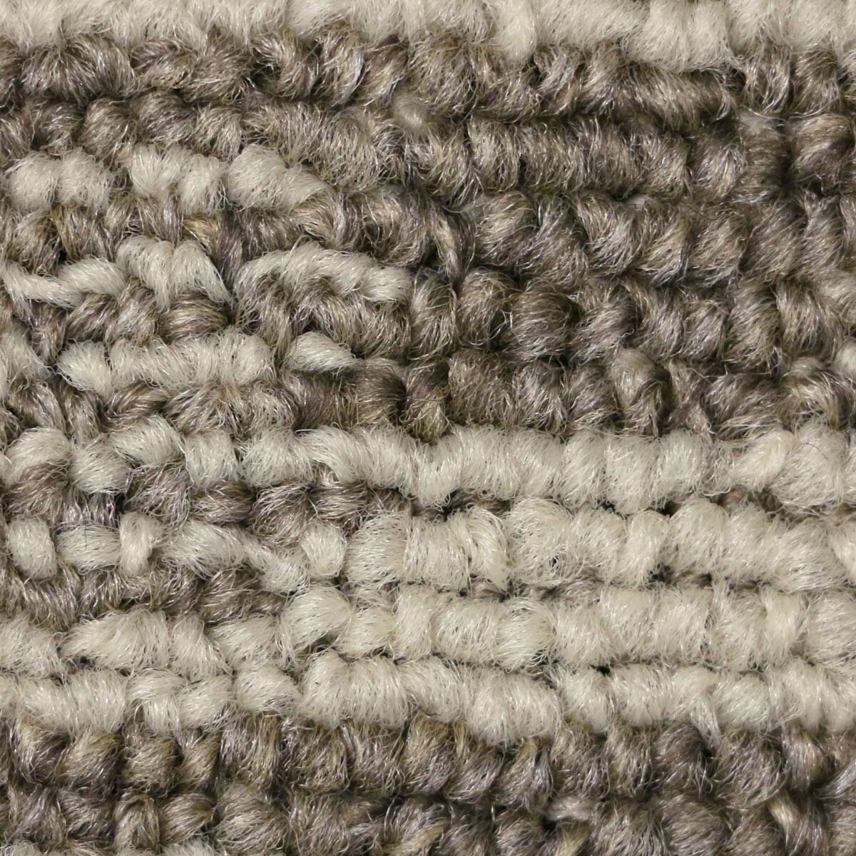 Close up of runner rug with beige and brown geometric pattern