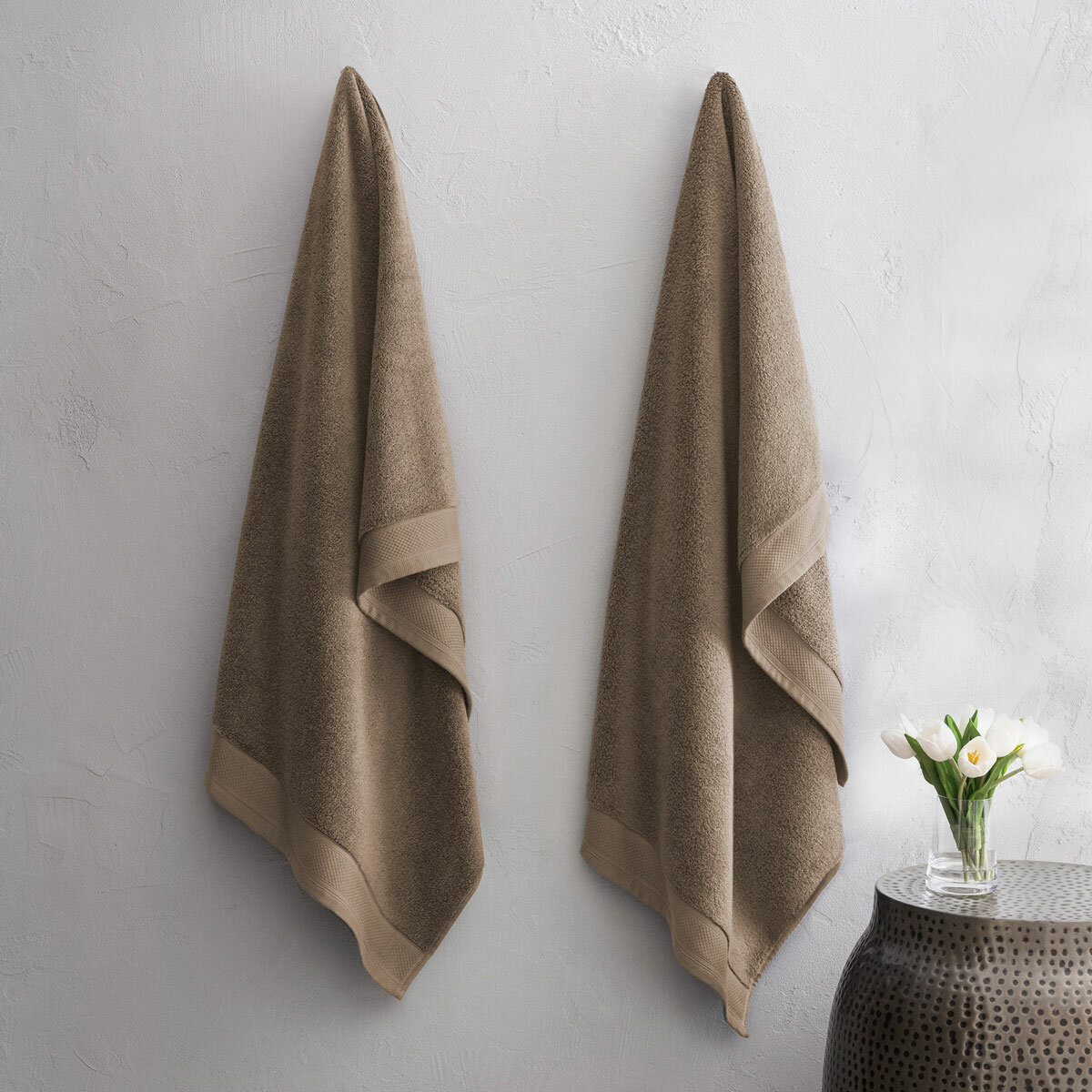 Two taupe towels hanging