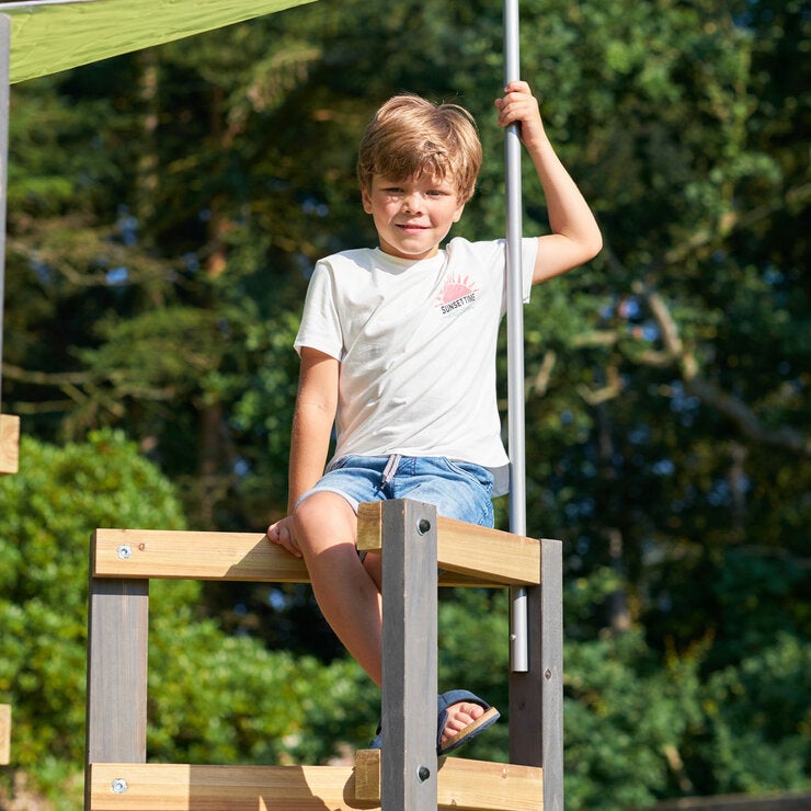 A lifestyle image of a child on the swingset A lifestyle image of a child on the swingset