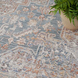 Elegant heirloom rug, tradtional design in blue, grey, rust and ivory tones
