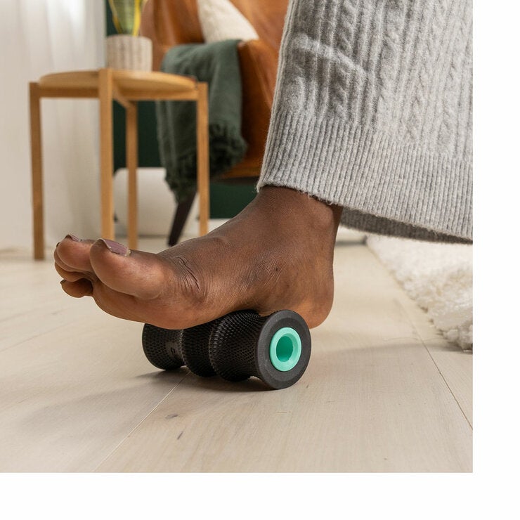 Lifestyle image of a person using a wheel on their foot
