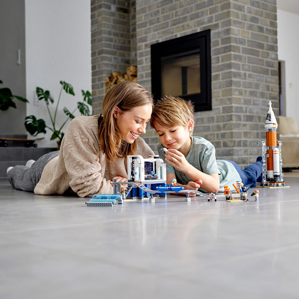 Lifestyle image of children playing with the deep space rocket with launch control