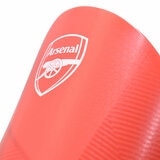 Studio image showing a close up of the Arsenal logo on the shin guards Studio image showing a close up of the Arsenal logo on the shin guards