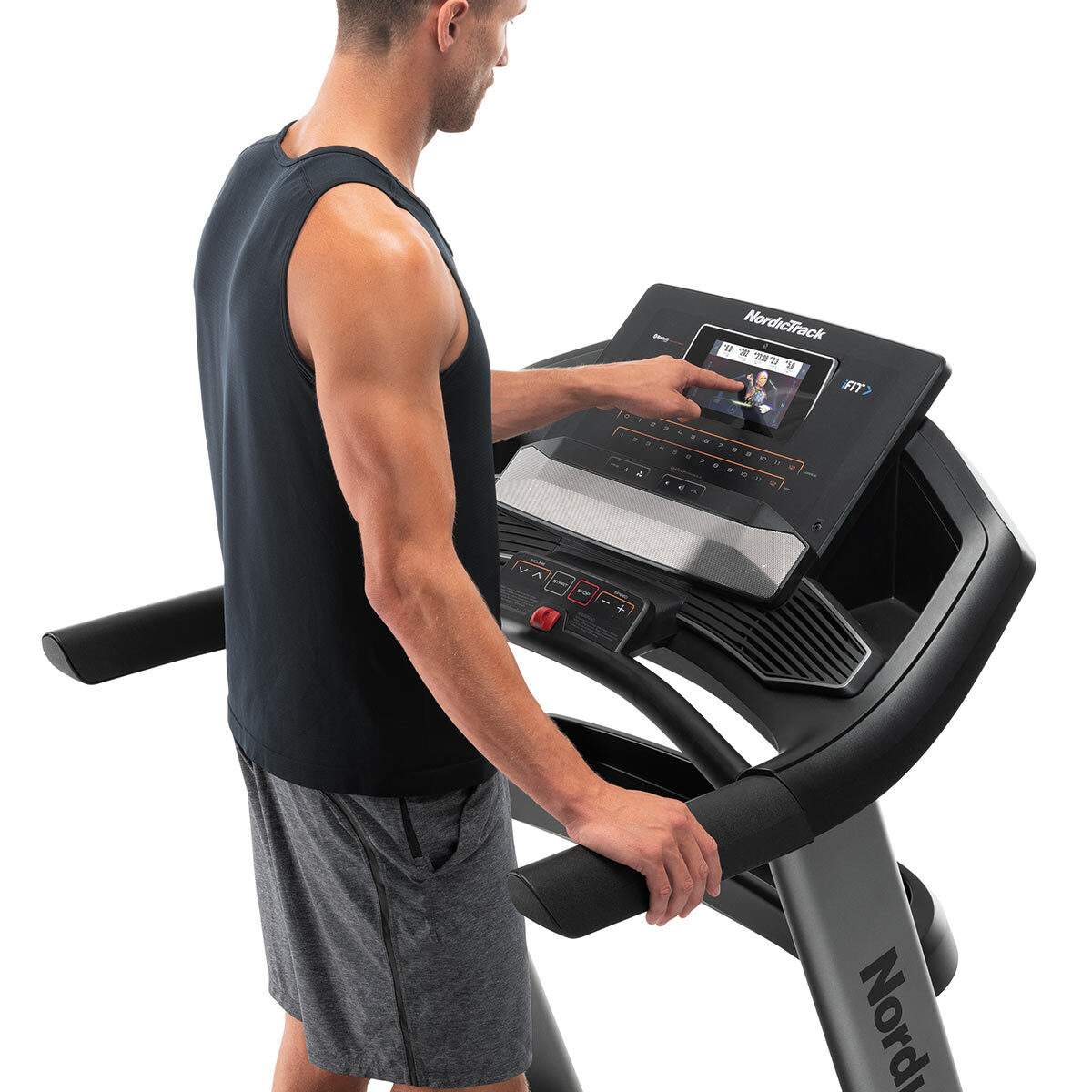 Man using touchscreen display Image for Nordic Track Elite 900 Treadmill