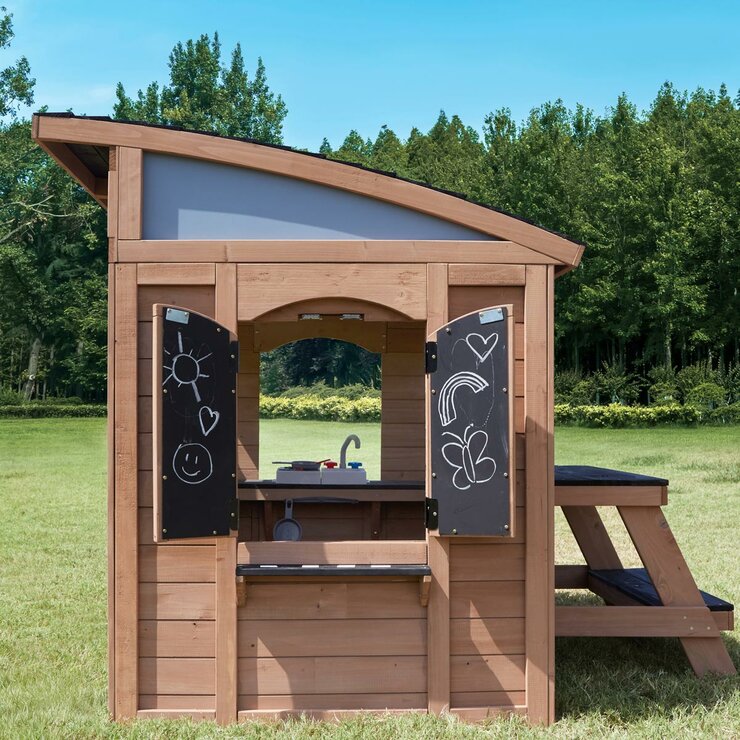 Lifestyle image showing the side of the playhouse, chalkboard shutters open