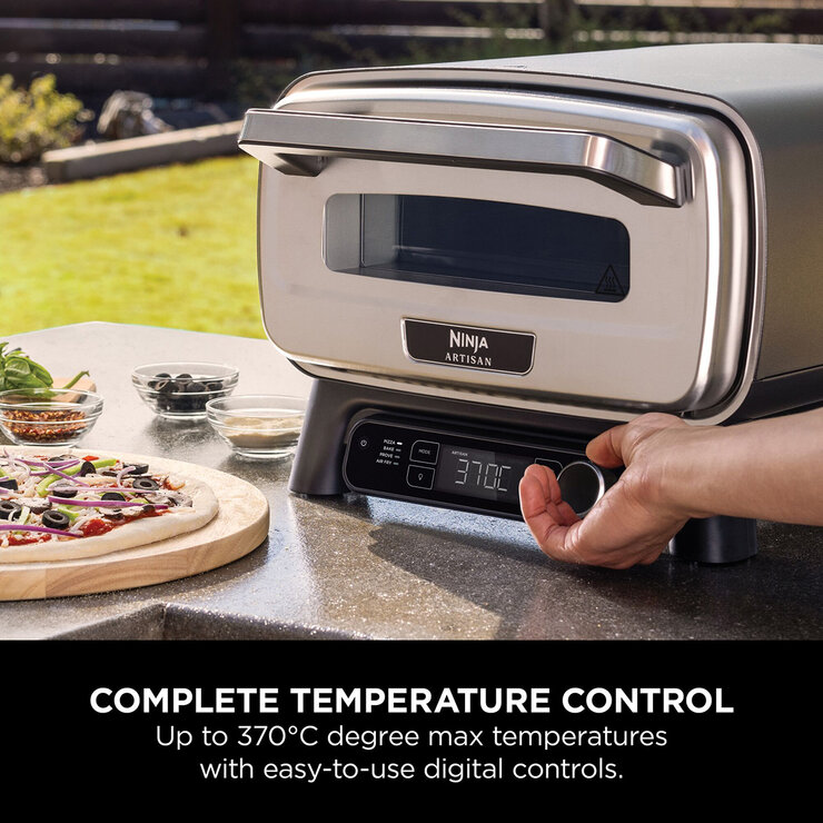 Lifestyle image of pizza oven being used outdoors reaching up to 370 degrees Lifestyle image of pizza oven being used outdoors reaching up to 370 degrees