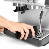 Close up of Krups Precision Coffee Machine being cleaned