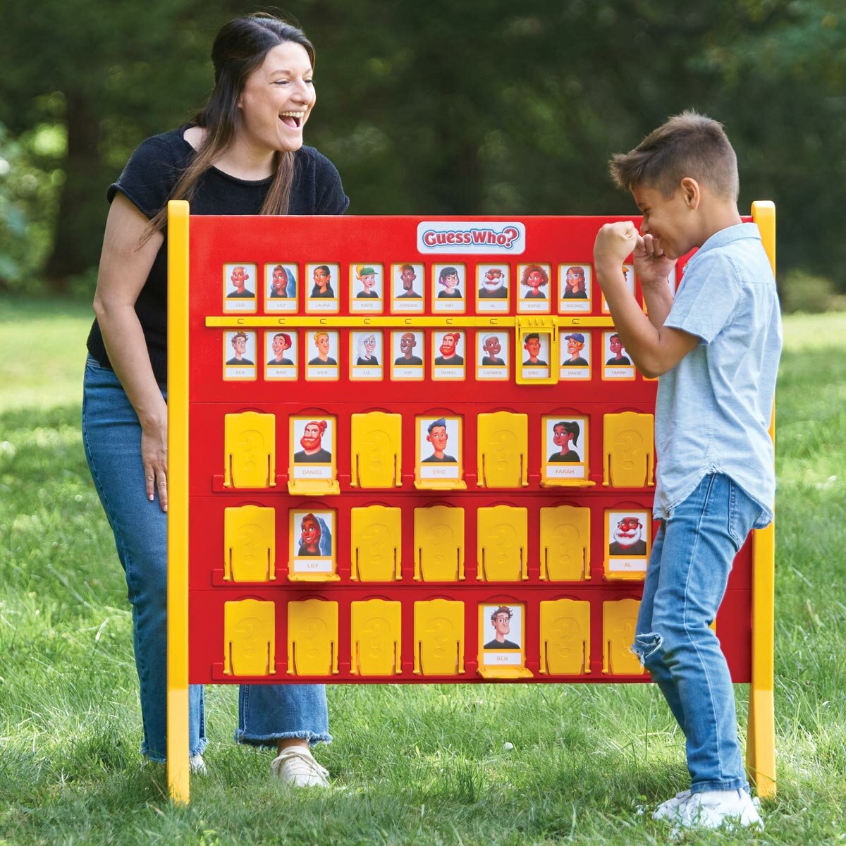 Lifestyle image of a woman and child playing Guess Who? game